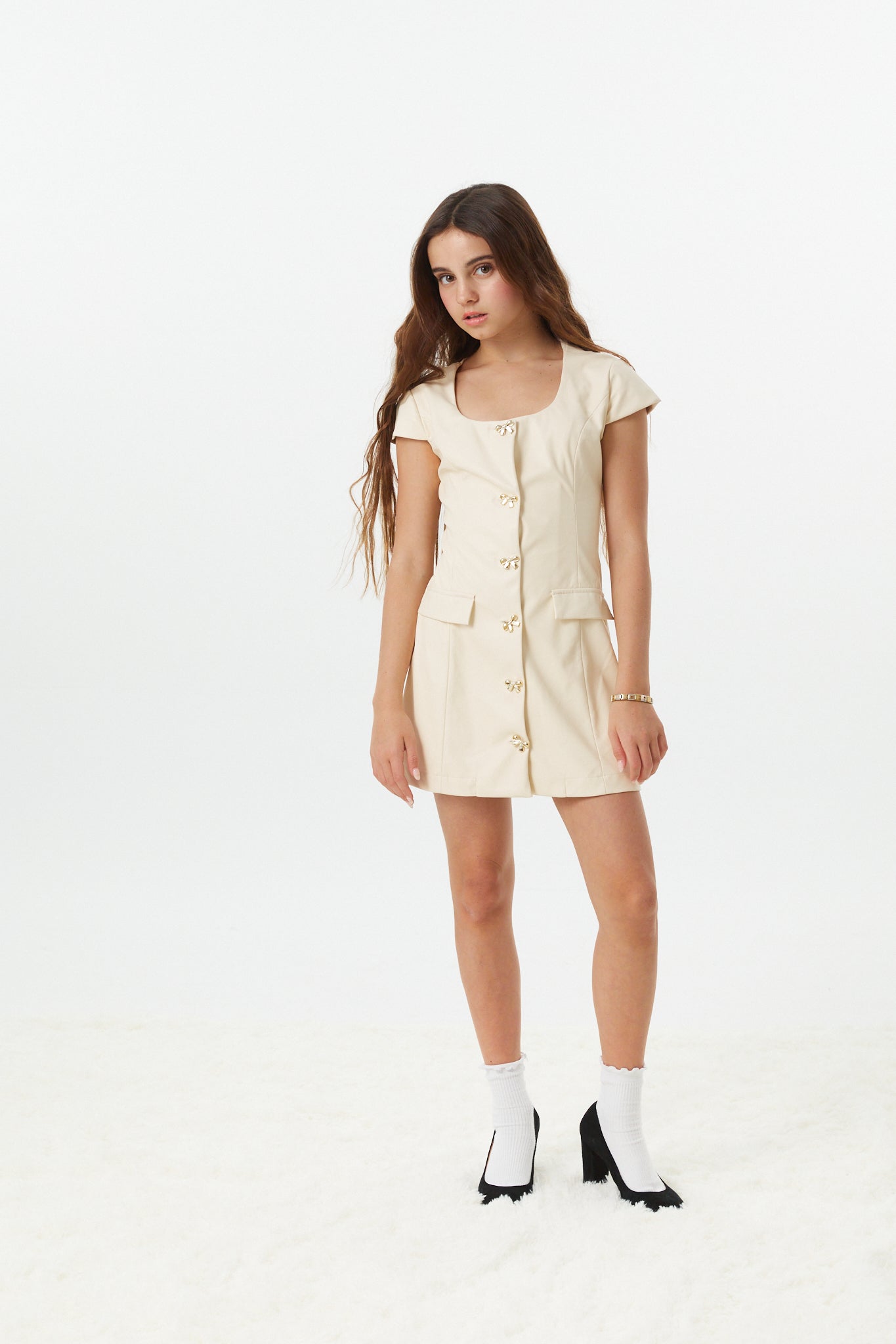 Zoe Cream With Bow Buttons Vegan Leather Cap Sleeve